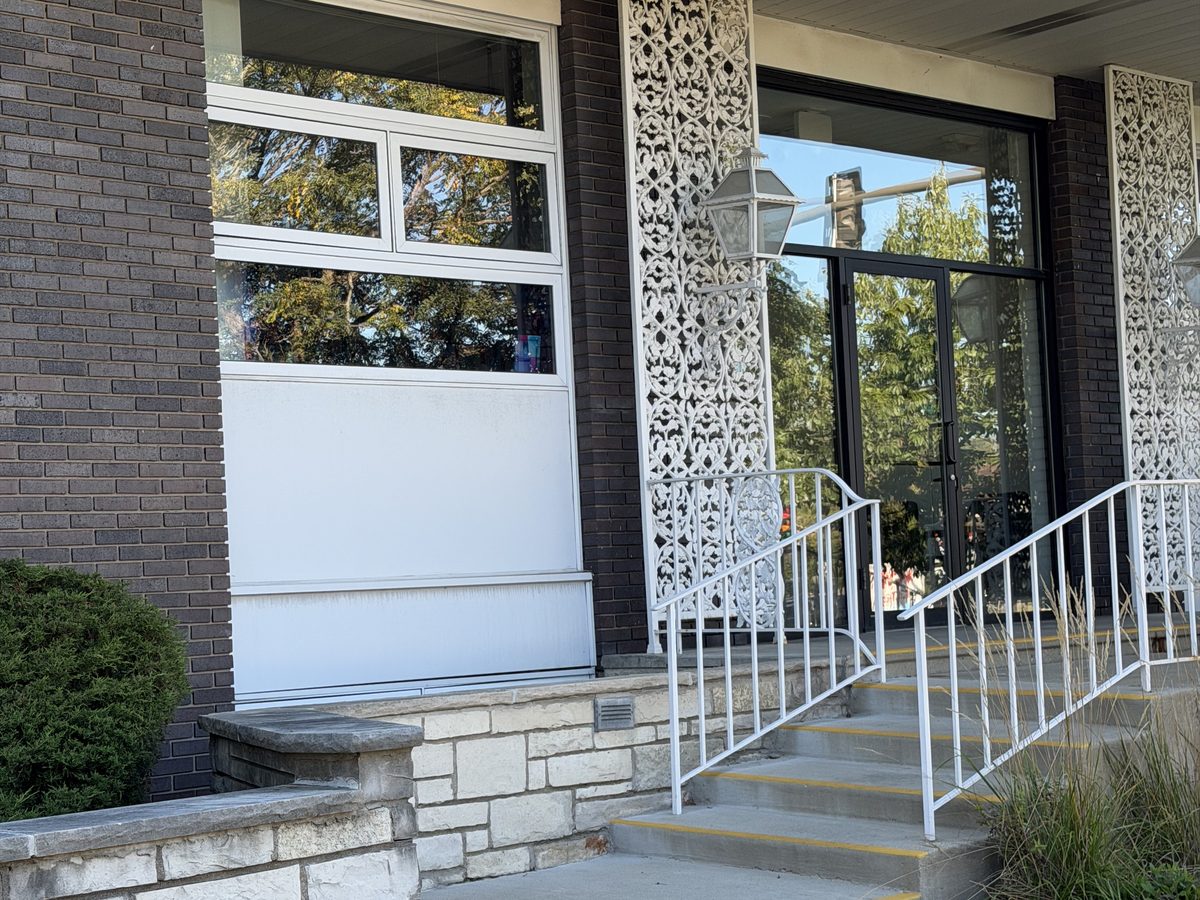 Entrance to the OnPoint Evanston office at 2550 Crawford Avenue — steps with white railings up to glass doors